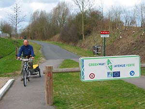 man cycling on avenue vert